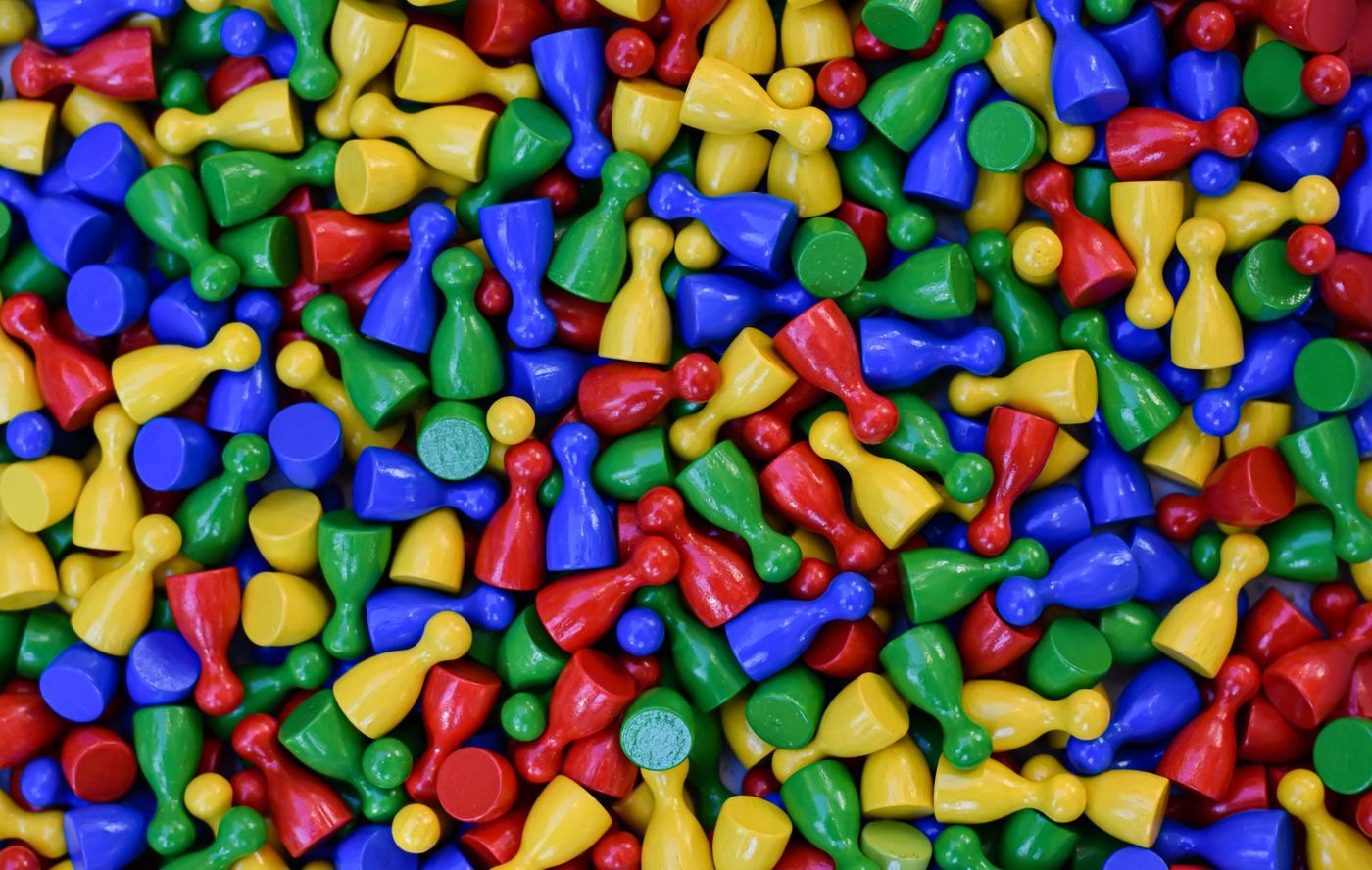 A collection of colourful pawn-shaped game pieces