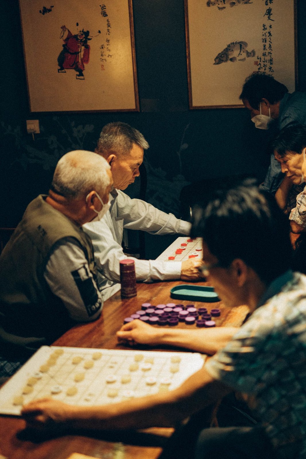 A group gathered at a table to play a board game