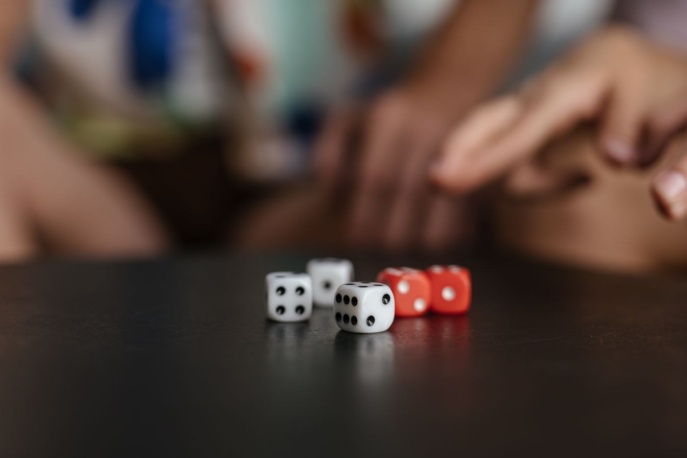 White and red dice waiting on a tabletop