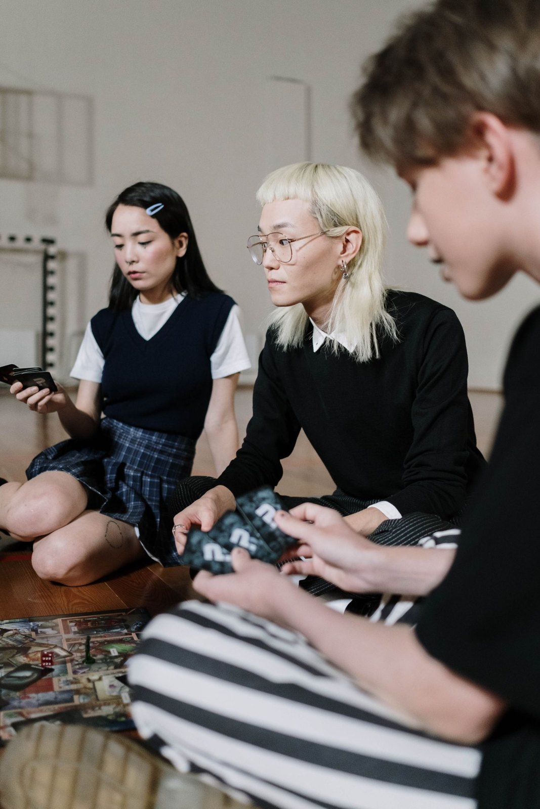 Young players discussing a game set out on the floor